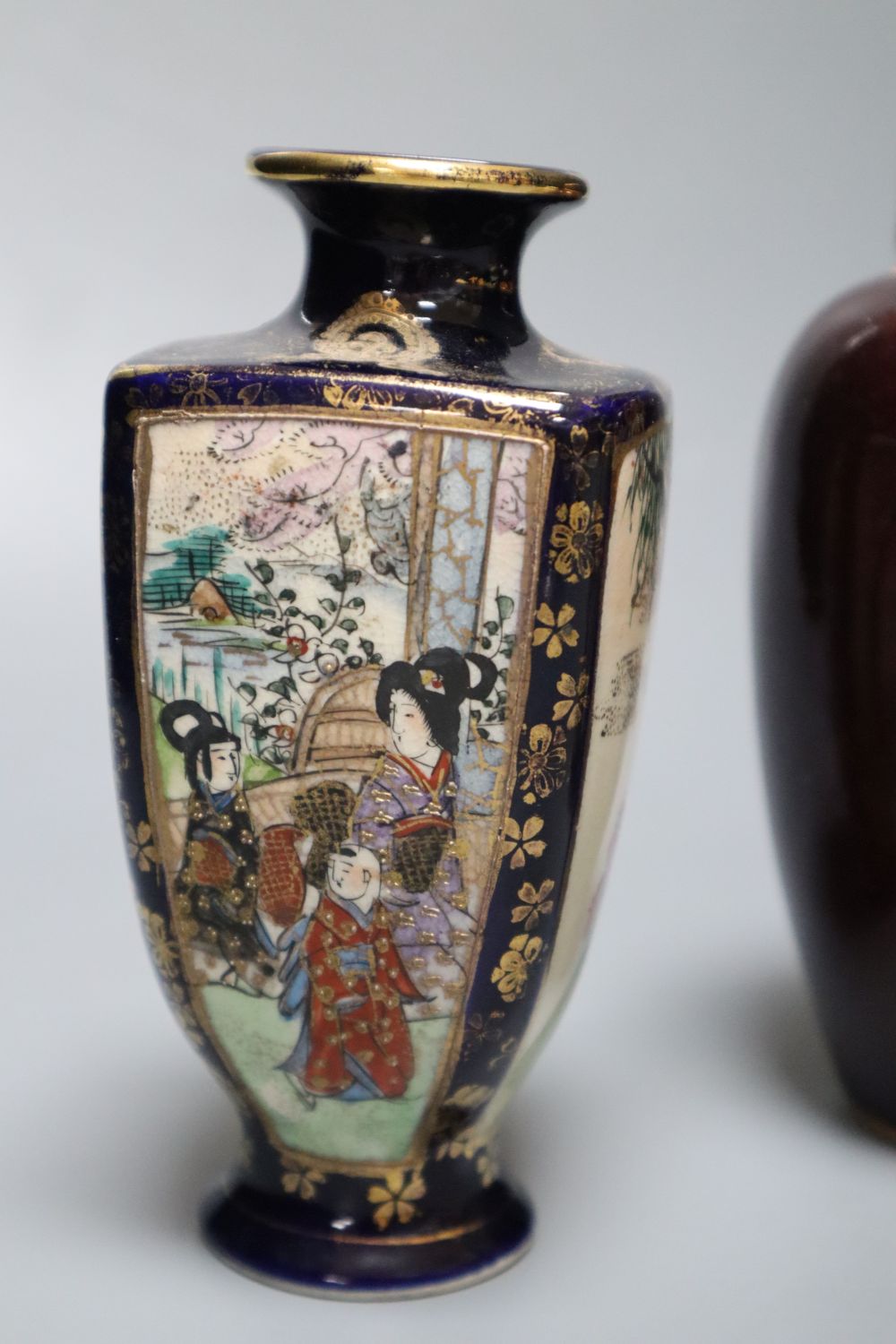 A Chinese deep red glazed jar and cover, 16cm, and two Satsuma vases